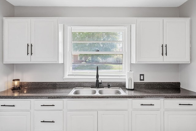 211 Navaho Trl, Hopkinsville, KY 42240 - kitchen featuring dark countertops and white cabinets