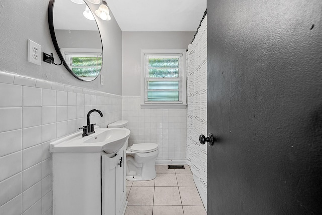 211 Navaho Trl, Hopkinsville, KY 42240 - bathroom with tile patterned flooring, vanity, a wainscoted wall, and tile walls