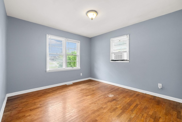 211 Navaho Trl, Hopkinsville, KY 42240 - unfurnished room featuring hardwood / wood-style floors and cooling unit