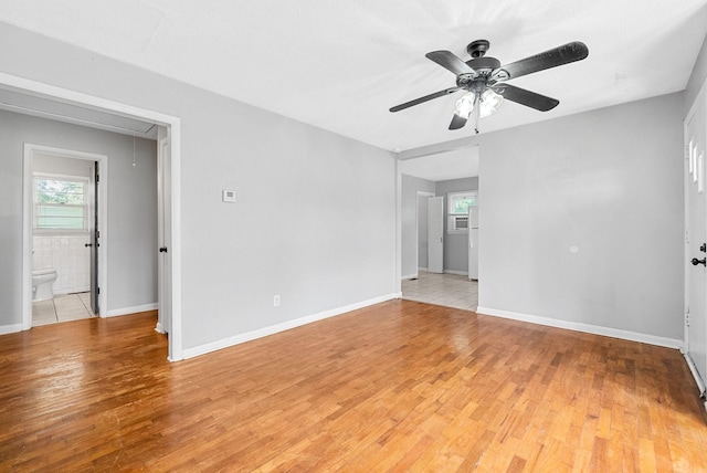 211 Navaho Trl, Hopkinsville, KY 42240 - unfurnished room with light wood-style flooring, a ceiling fan, and attic access
