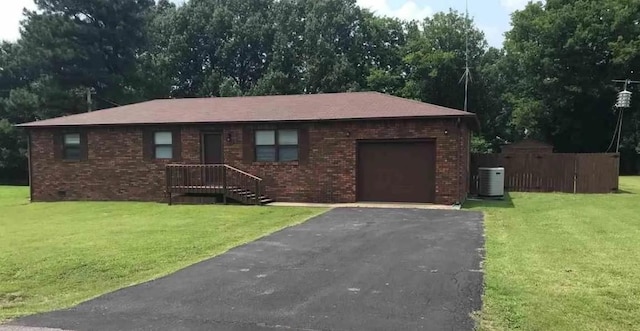 169 Wyndotte Way, Ledbetter, KY 42058 - single story home featuring an attached garage, brick siding, asphalt driveway, and a front yard