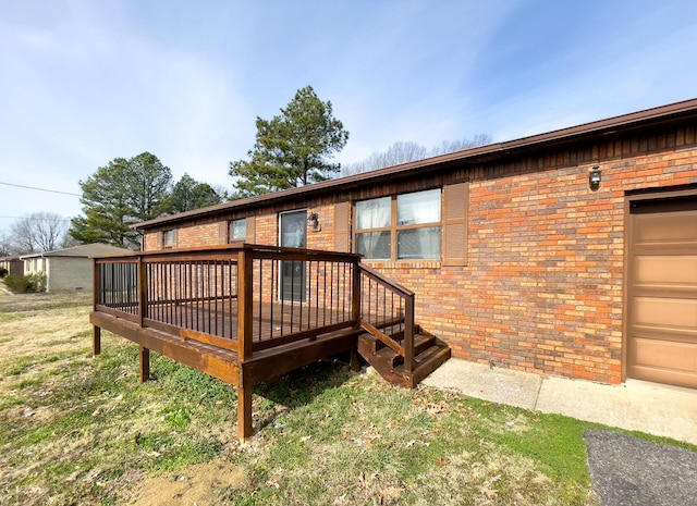 169 Wyndotte Way, Ledbetter, KY 42058 - back of property with brick siding and a deck