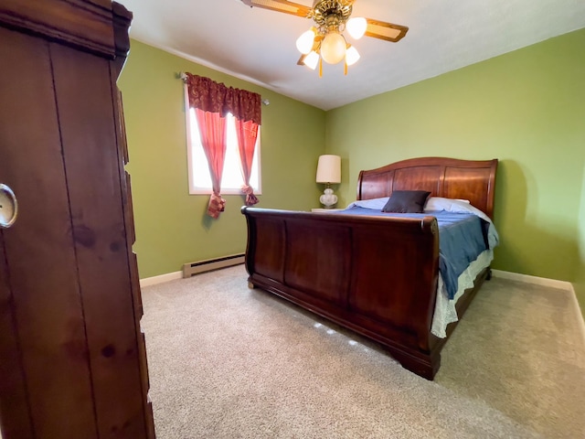 169 Wyndotte Way, Ledbetter, KY 42058 - bedroom featuring a baseboard radiator, carpet flooring, and a ceiling fan