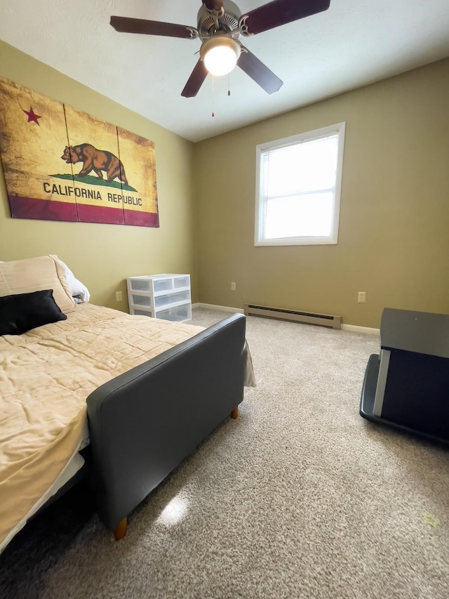 169 Wyndotte Way, Ledbetter, KY 42058 - bedroom featuring baseboard heating, carpet floors, and a ceiling fan