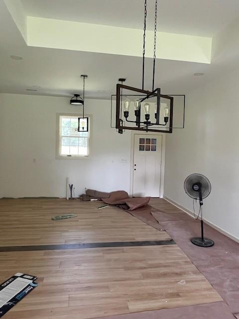1798 Twin Caves Dr, Lewisburg, TN 37091 - unfurnished dining area featuring wood finished floors and a chandelier