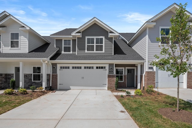 514 Rohan Dr, Murfreesboro, TN 37129 - craftsman house featuring concrete driveway, roof with shingles, brick siding, and a garage