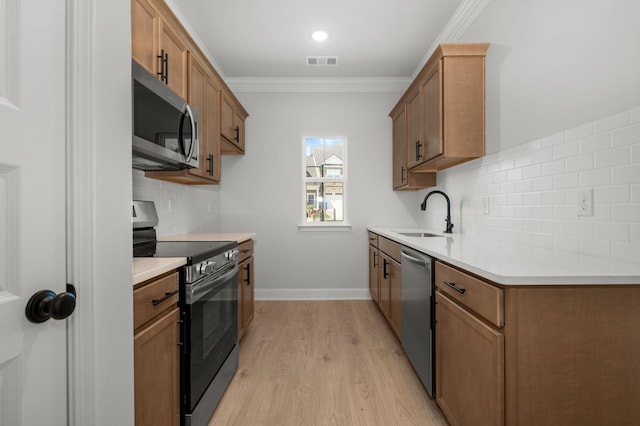 514 Rohan Dr, Murfreesboro, TN 37129 - kitchen with appliances with stainless steel finishes, light wood-style floors, crown molding, decorative backsplash, and light countertops