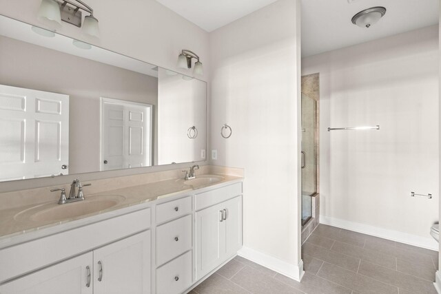 604 Douglas St, Lebanon, TN 37087 - full bathroom with a shower stall, double vanity, and tile patterned floors