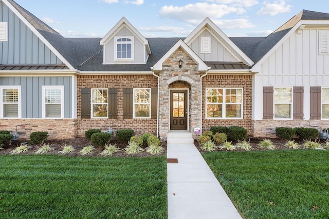 604 Douglas St, Lebanon, TN 37087 - view of front facade featuring board and batten siding, a front lawn, and a shingled roof