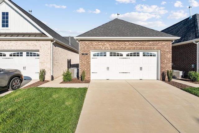 604 Douglas St, Lebanon, TN 37087 - view of front facade featuring brick siding, a shingled roof, a garage, and board and batten siding
