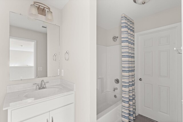 604 Douglas St, Lebanon, TN 37087 - bathroom featuring shower / bathtub combination with curtain and vanity