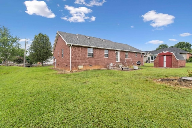 1011 Shirley Dr, Lebanon, TN 37087 - back of property with a storage unit, brick siding, a yard, a patio area, and crawl space