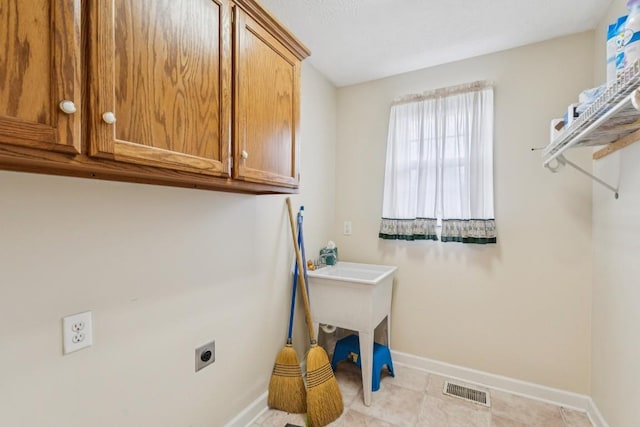 1011 Shirley Dr, Lebanon, TN 37087 - laundry area featuring hookup for an electric dryer and cabinet space