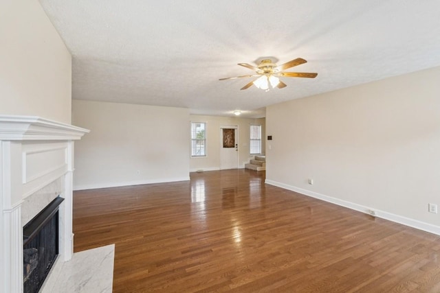 1011 Shirley Dr, Lebanon, TN 37087 - unfurnished living room with ceiling fan, wood finished floors, and a premium fireplace