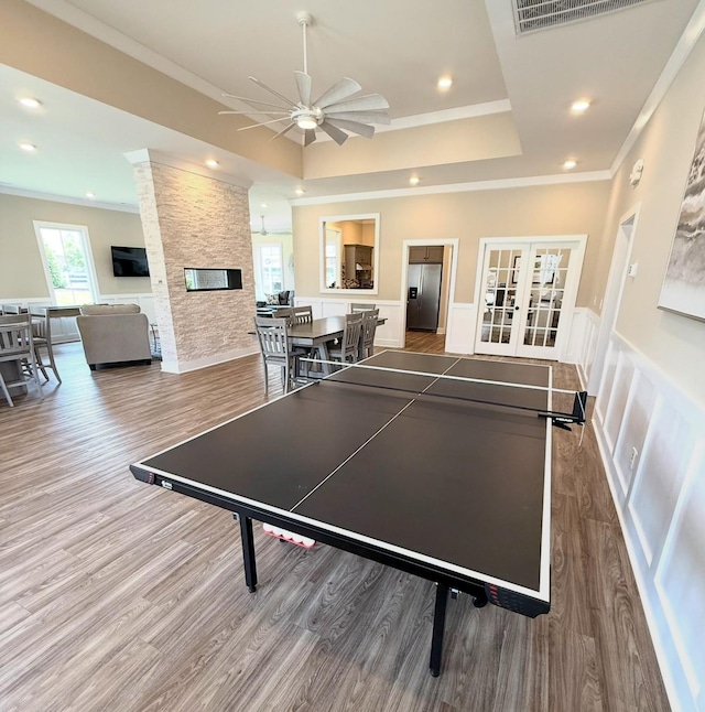 516 Rohan Dr, Murfreesboro, TN 37129 - game room featuring a raised ceiling, wood finished floors, crown molding, a ceiling fan, and french doors