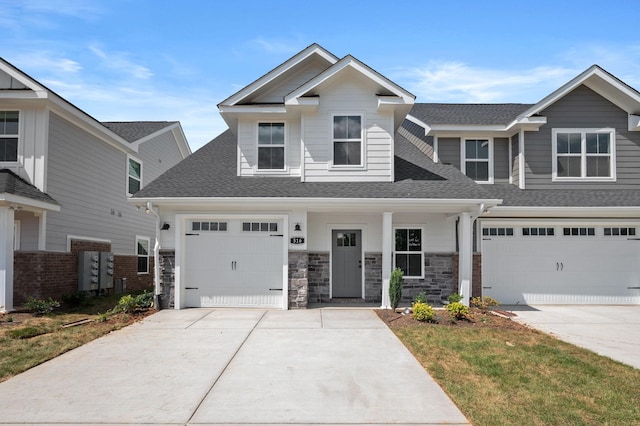 516 Rohan Dr, Murfreesboro, TN 37129 - craftsman-style home with concrete driveway, a shingled roof, and stone siding