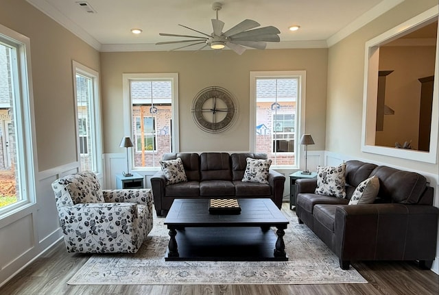 516 Rohan Dr, Murfreesboro, TN 37129 - living room featuring wood finished floors, a wainscoted wall, a decorative wall, ornamental molding, and a ceiling fan