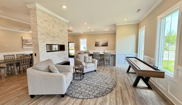 1910 Charadon Ct, Murfreesboro, TN 37129 - living area featuring crown molding, light wood-style flooring, a wainscoted wall, and a decorative wall