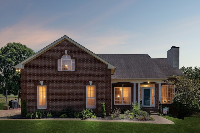 131 E Robertson Rd, Castalian Springs, TN 37031 - traditional home featuring brick siding, a front lawn, and a chimney