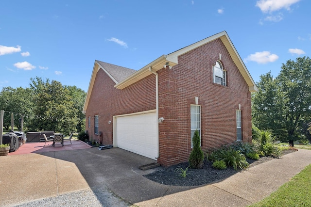 131 E Robertson Rd, Castalian Springs, TN 37031 - view of property exterior featuring brick siding and asphalt driveway