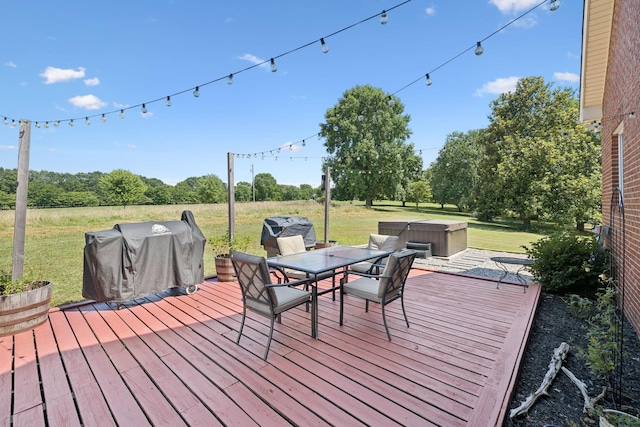 131 E Robertson Rd, Castalian Springs, TN 37031 - deck featuring a hot tub, grilling area, outdoor dining space, and a lawn