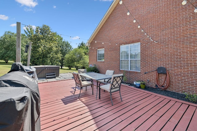 131 E Robertson Rd, Castalian Springs, TN 37031 - wooden deck featuring a hot tub, outdoor dining area, and grilling area