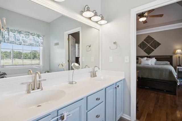 131 E Robertson Rd, Castalian Springs, TN 37031 - full bath with connected bathroom, ceiling fan, double vanity, and wood finished floors