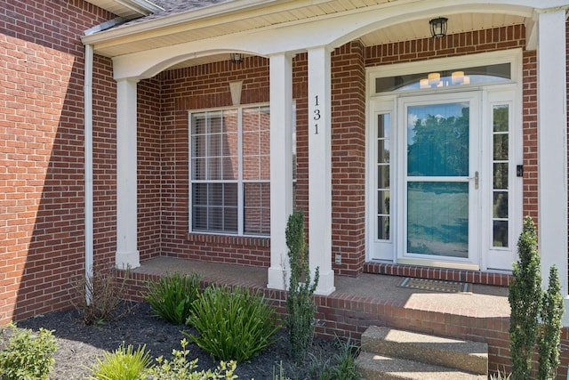 131 E Robertson Rd, Castalian Springs, TN 37031 - doorway to property featuring brick siding and covered porch