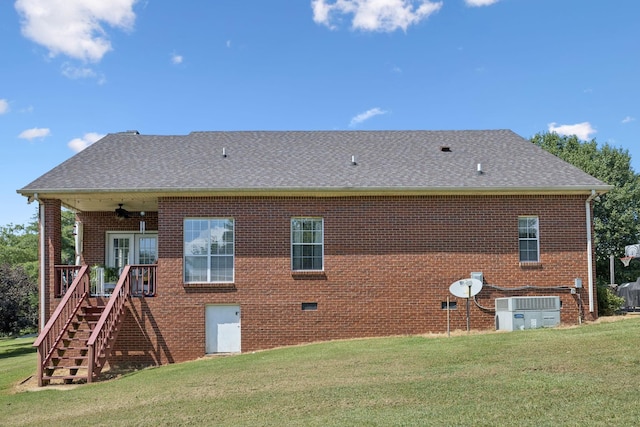 131 E Robertson Rd, Castalian Springs, TN 37031 - back of house featuring a yard, roof with shingles, brick siding, and stairs