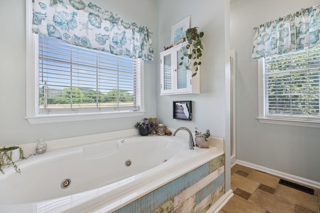 131 E Robertson Rd, Castalian Springs, TN 37031 - full bathroom with plenty of natural light and a whirlpool tub