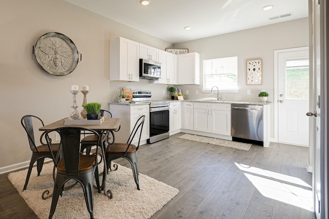 225 Tara Ct Unit 225, Columbia, TN 38401 - kitchen featuring stainless steel appliances, white cabinetry, light wood-type flooring, and recessed lighting