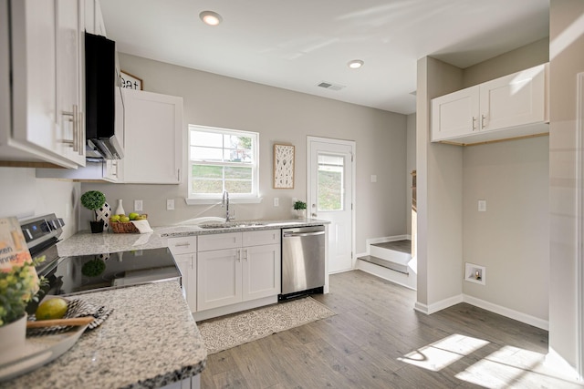 225 Tara Ct Unit 225, Columbia, TN 38401 - kitchen featuring stainless steel appliances, white cabinetry, light wood-type flooring, recessed lighting, and light stone counters