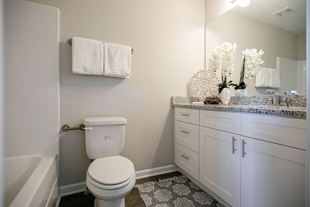225 Tara Ct Unit 225, Columbia, TN 38401 - bathroom with vanity, a tub, and wood finished floors