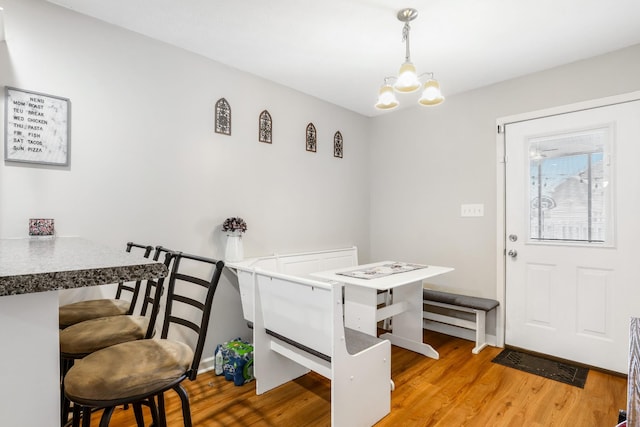 397 W Mcglothlin St, Portland, TN 37148 - dining space with a chandelier and wood finished floors