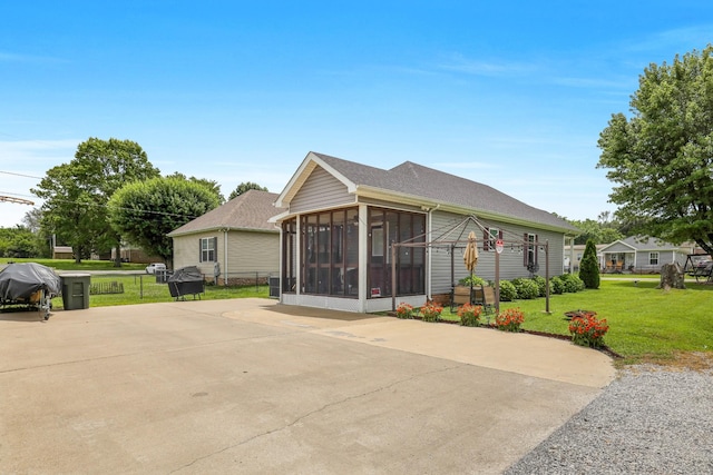 397 W Mcglothlin St, Portland, TN 37148 - view of property exterior featuring a sunroom, driveway, and roof with shingles