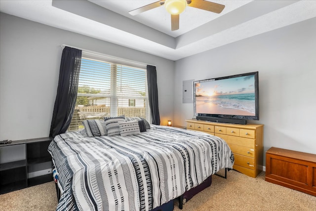 397 W Mcglothlin St, Portland, TN 37148 - bedroom with light carpet, a ceiling fan, and a tray ceiling