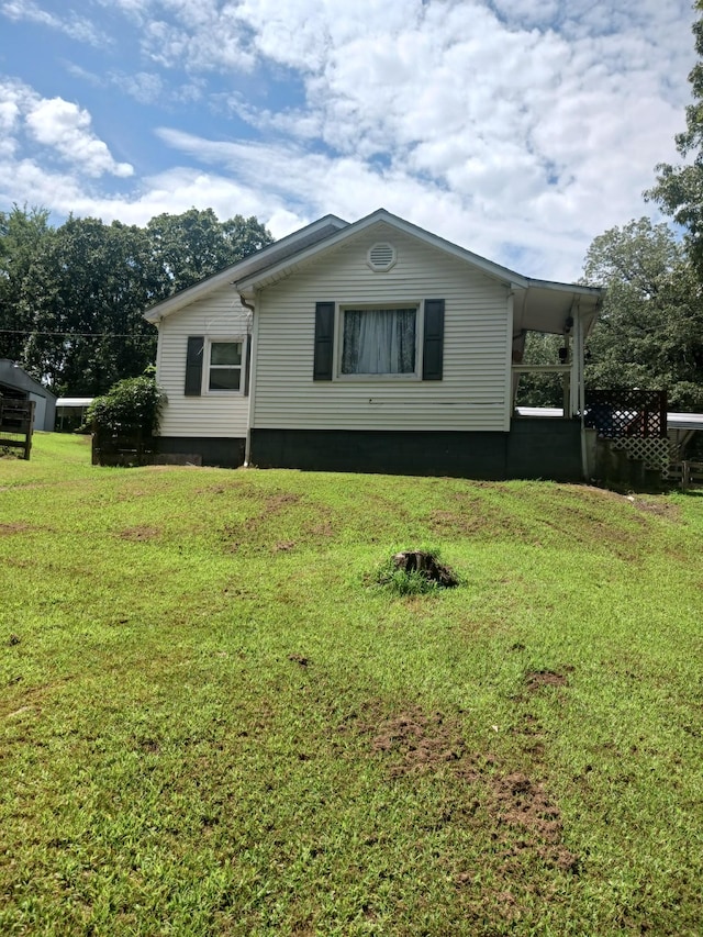 197 Stigall St, Camden, TN 38320 - view of home's exterior with a lawn