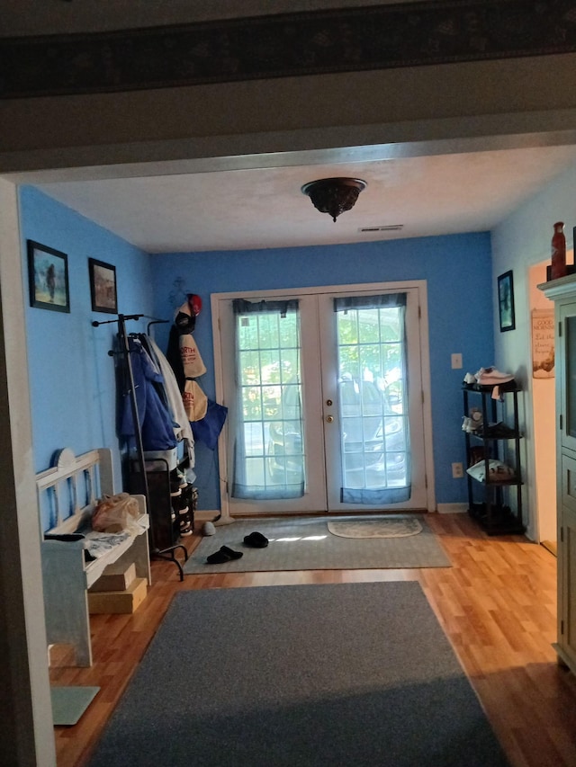 197 Stigall St, Camden, TN 38320 - entryway with french doors and wood finished floors