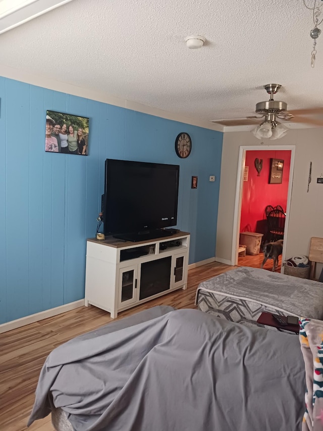 197 Stigall St, Camden, TN 38320 - bedroom with wood finished floors, a textured ceiling, and ceiling fan