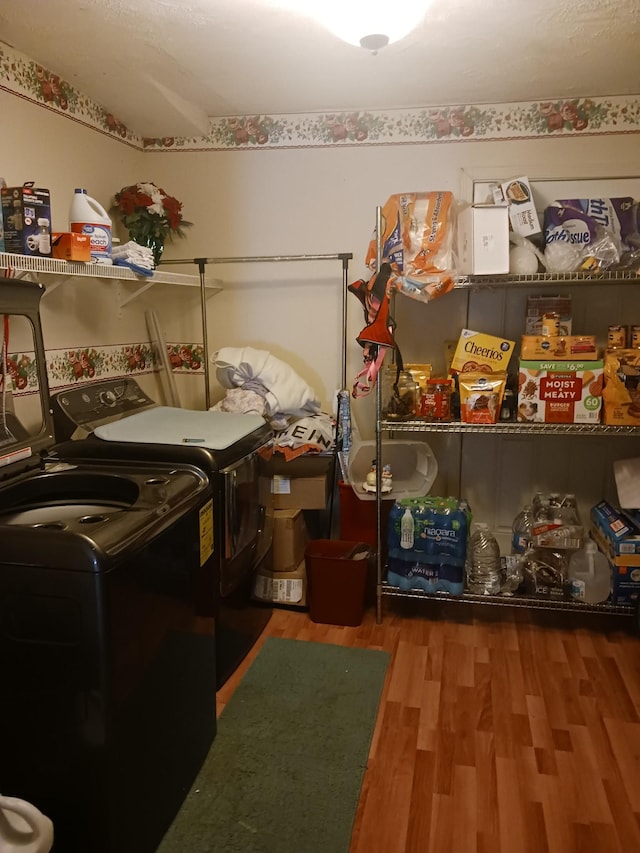 197 Stigall St, Camden, TN 38320 - laundry area featuring independent washer and dryer and wood finished floors