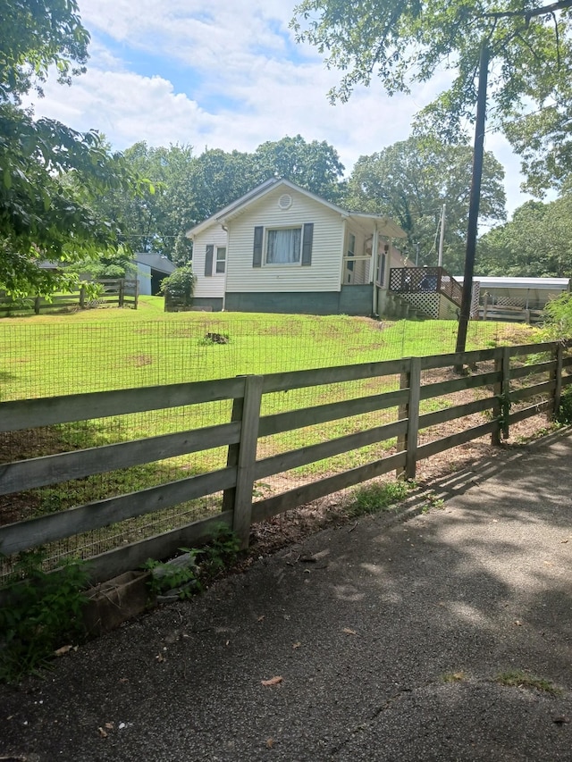 197 Stigall St, Camden, TN 38320 - view of home's exterior with a fenced front yard