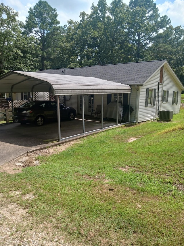 197 Stigall St, Camden, TN 38320 - view of vehicle parking featuring a detached carport