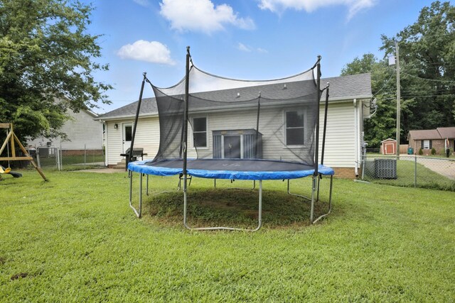 561 Danielle Dr, Clarksville, TN 37042 - rear view of house with a trampoline and a fenced backyard