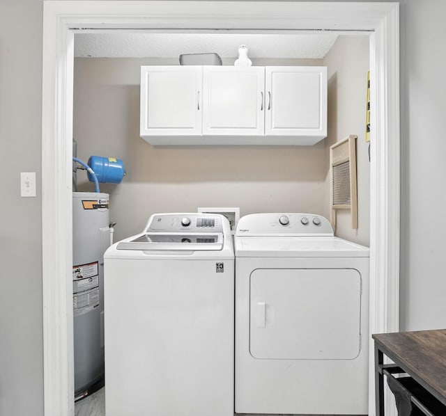 561 Danielle Dr, Clarksville, TN 37042 - washroom featuring cabinet space, electric water heater, and washer and clothes dryer