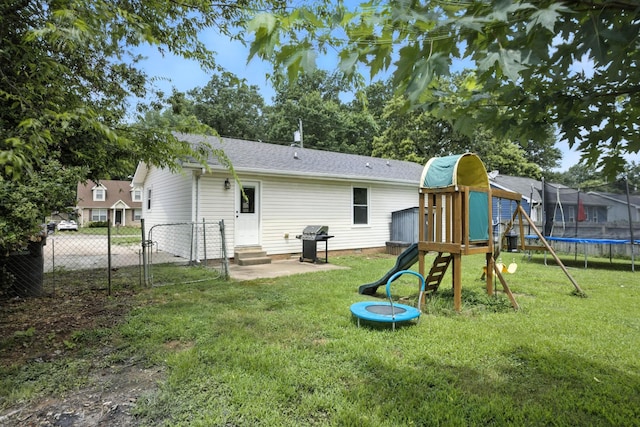 561 Danielle Dr, Clarksville, TN 37042 - back of property featuring a trampoline, a playground, entry steps, and a patio area