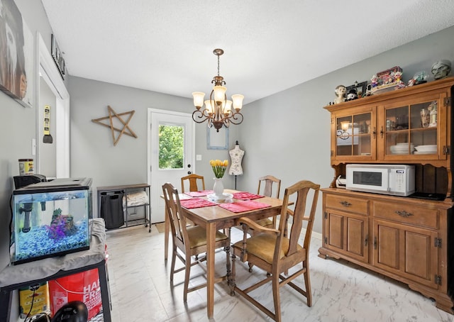 561 Danielle Dr, Clarksville, TN 37042 - dining room with a chandelier and light marble finish floors