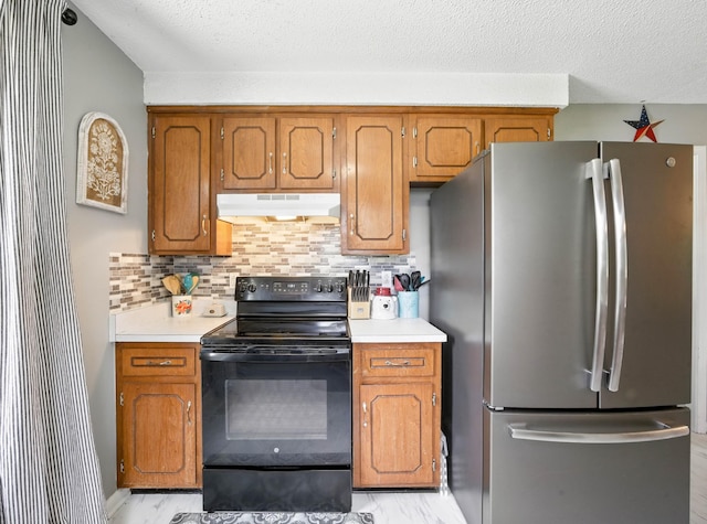 561 Danielle Dr, Clarksville, TN 37042 - kitchen with freestanding refrigerator, black range with electric stovetop, under cabinet range hood, light countertops, and brown cabinets