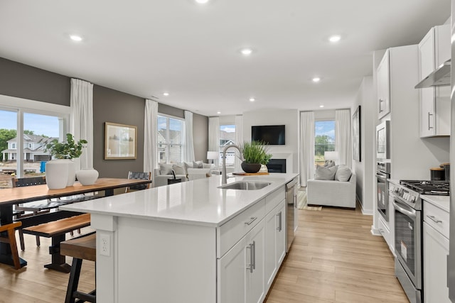 3412 Shigo St, Murfreesboro, TN 37130 - kitchen with open floor plan, appliances with stainless steel finishes, light countertops, white cabinets, and recessed lighting