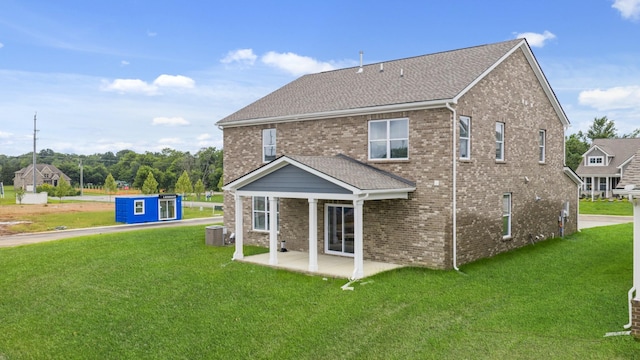 3412 Shigo St, Murfreesboro, TN 37130 - back of house with brick siding, a patio area, a lawn, and a shingled roof