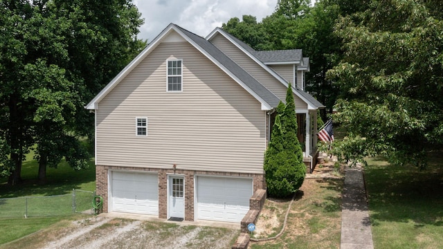 1006 Summer Ln, Pleasant View, TN 37146 - view of side of property featuring dirt driveway, an attached garage, and brick siding